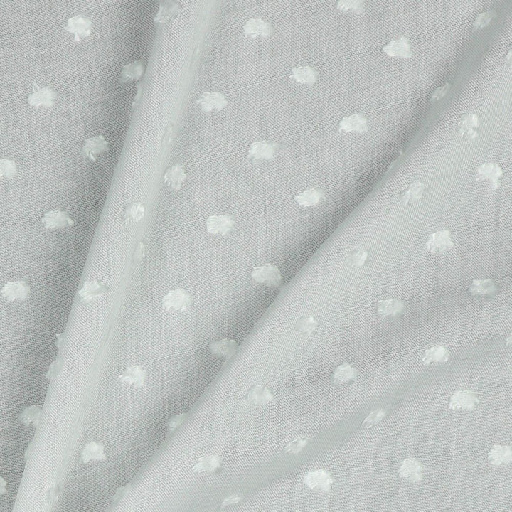 Viscose dobby textured spot polkadot dress fabric. Sage green and white