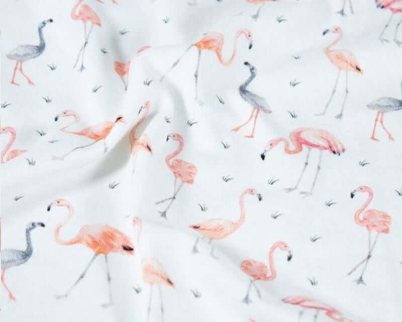 Flamingos Cotton Jersey by Blooming Fabrics. White, pink.