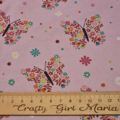 Tricot floral butterfly stretch cotton jersey knit fabric, by the half metre. Pink.