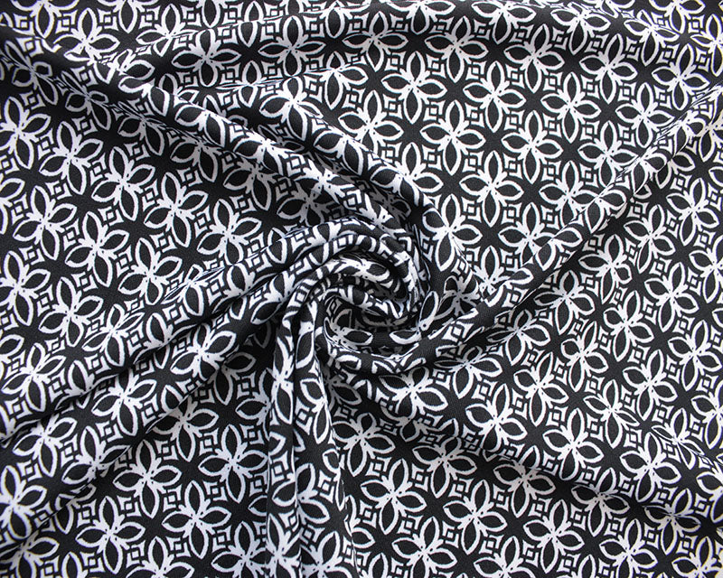Monochrome Flower Tiles stretch jersey knit fabric. Cut to order in .5 m increments.