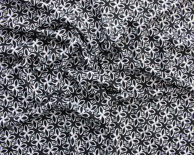 Monochrome Flower Tiles stretch jersey knit fabric. Cut to order in .5 m increments.