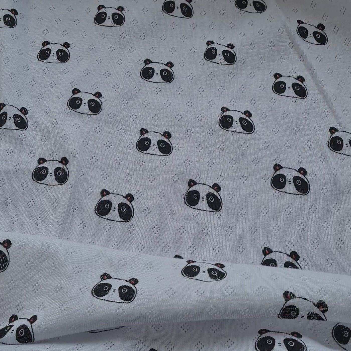 Panda Fine 100% cotton jersey knit with Diamond openwork/ Pointelle fabric. By Poppy. Cut to order by the 1/2 metre.