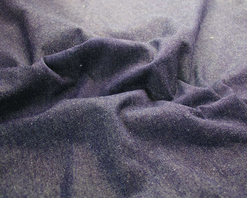 9 oz Stretch Denim: blue and black cotton 2% spandex. Dressmaking fabric. Sold by the half metre