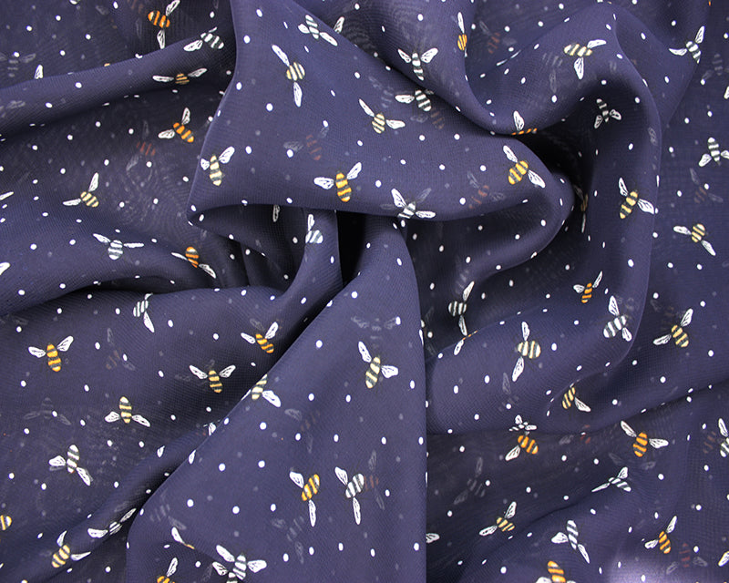 Bees spotty navy blue dobby 100% polyester chiffon dress fabric by half metre.