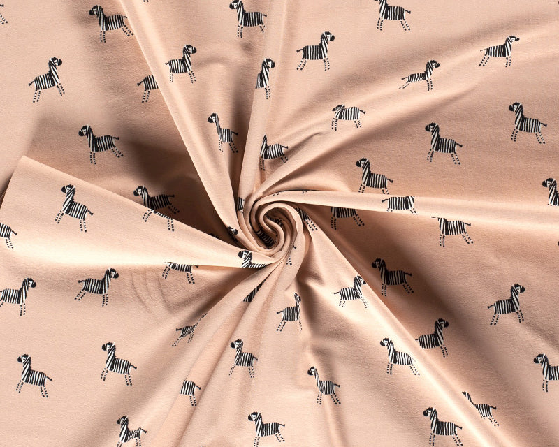 Zebra printed Jersey pink cotton stretch jersey knit fabric. By the half metre.